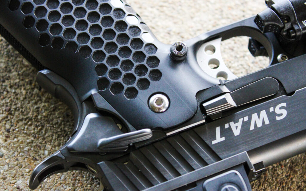 Close up of the STP S.W.A.T. controls, showing the safety, slide release, and magazine release