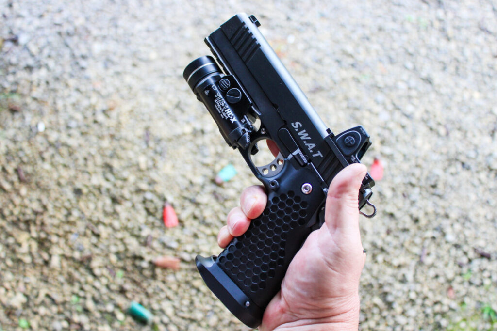 hand holding the STP S.W.A.T pistol.