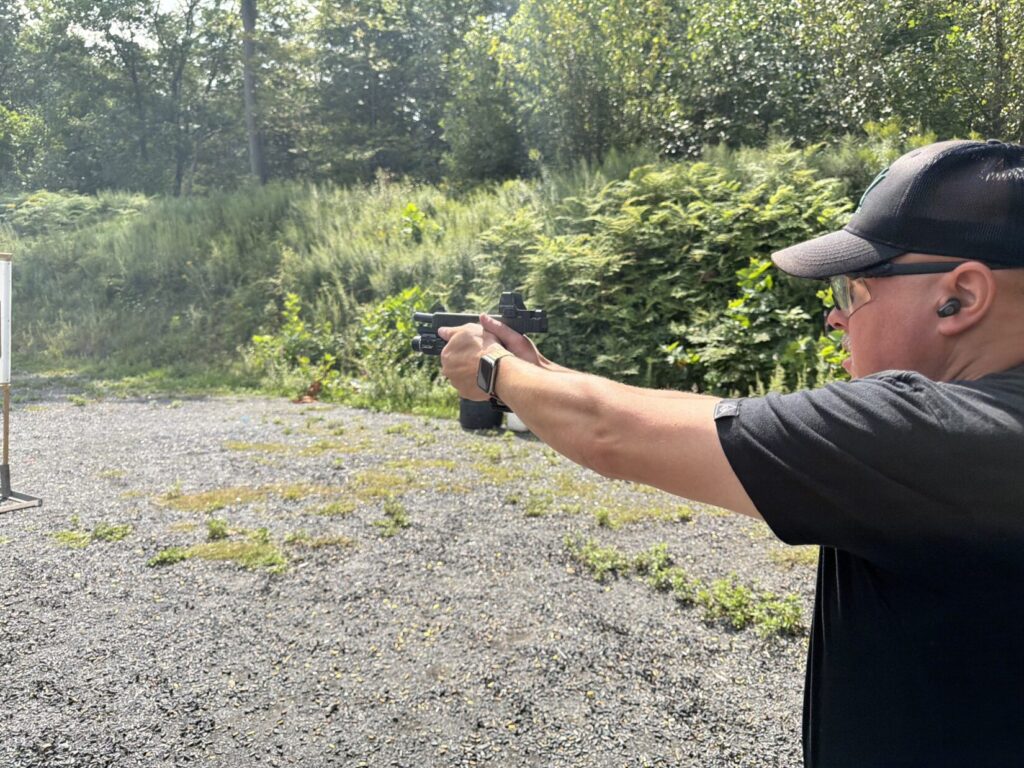 A retired detective firing a Glock 47 during side-by-side testing against the Glock 17 Gen 6