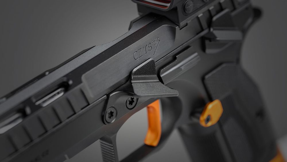 Close-up of the CZ TS3 Orange's oversized gas pedal and redesigned competition trigger