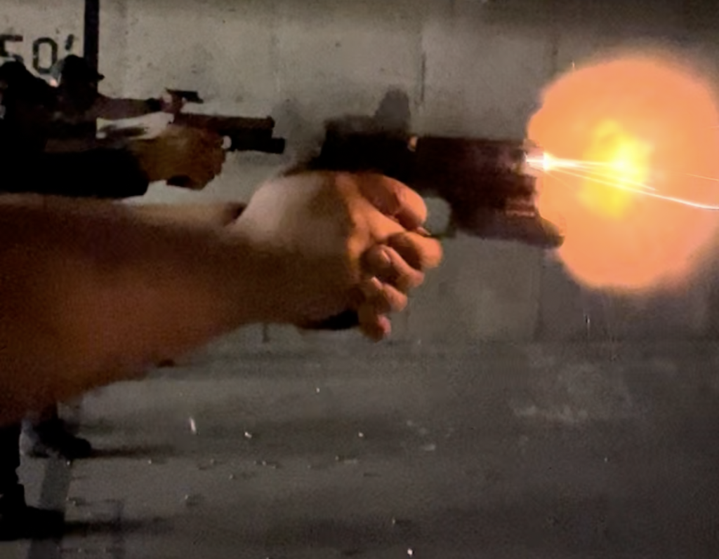 Video capture of a student's muzzle flash with training ammo during a War HOGG Tactical low light pistol course