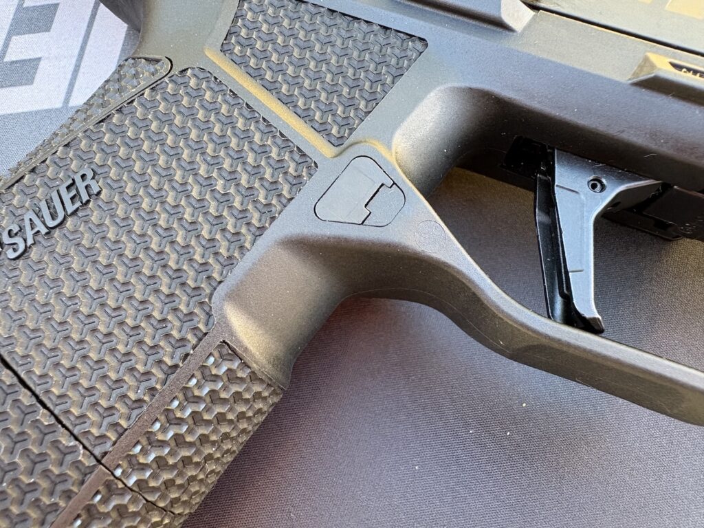 Sig's P385 grips are cut in deep below the trigger. The guns have a low bore axis and this helps keep your hand high on the grip.