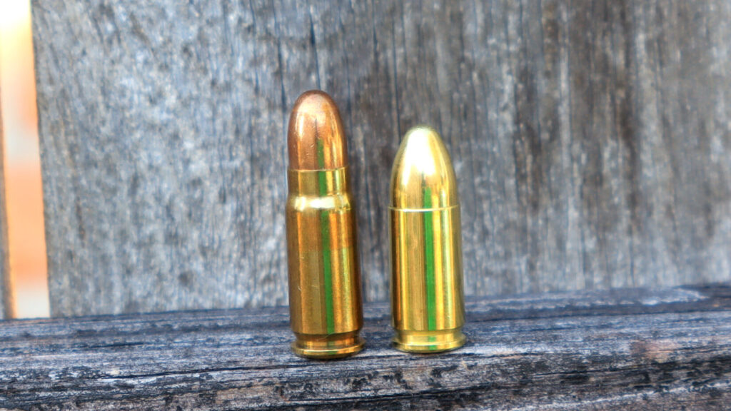7.65mm borchardt next to a 9mm Luger cartridge