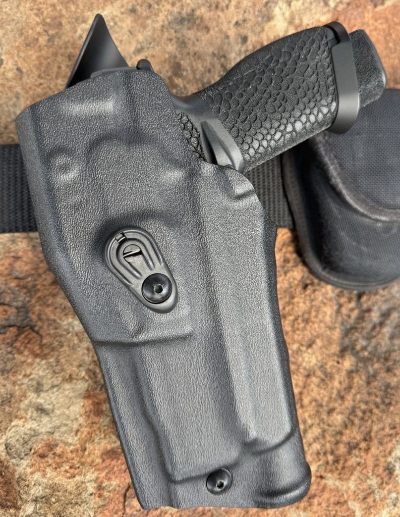 The Echelon Pro, with Trijicon and Streamlight attached, rests secured in Safariland's duty holster.