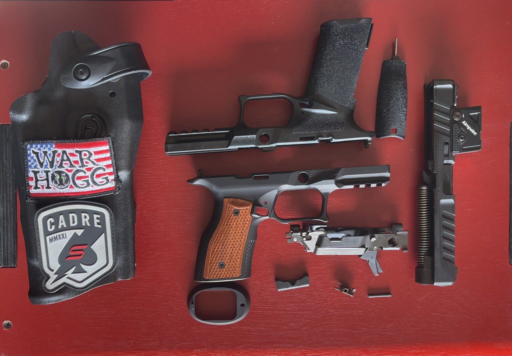 Springfield Echelon disassembled next to a Sharps Bros. grip module and a Safariland holster