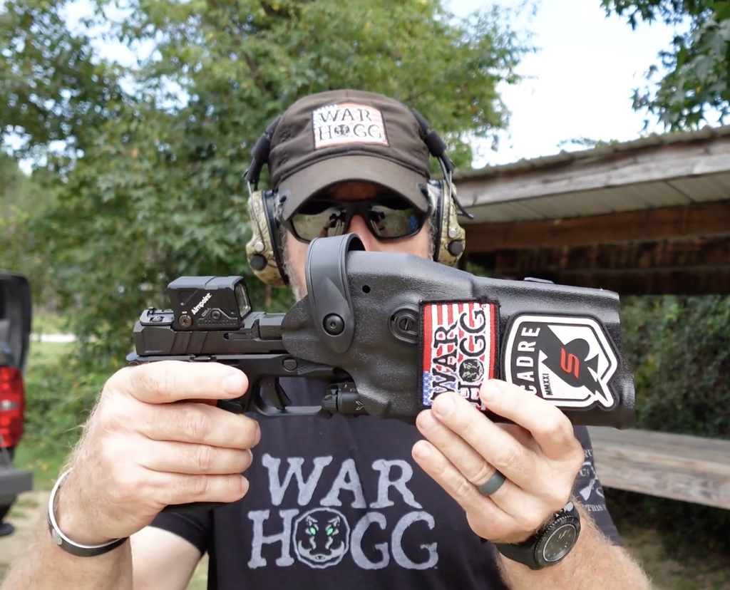 Rick Hogg of War HOGG Tactical holstering a Springfield Echelon with a Sharps Bros. grip module in a Safariland holster