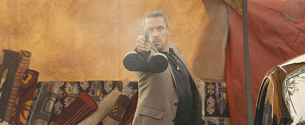 Scene from Skyfall (2012) showing a Glock 18 with an 100-round Beta-C drum magazine